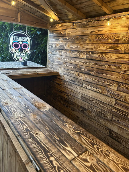 Wooden interior with a neon sign featuring a skull design.